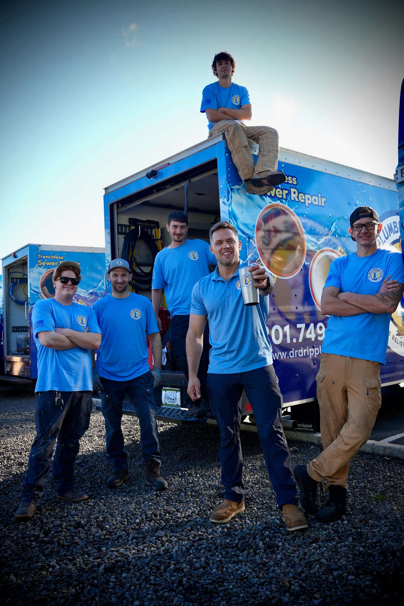 The Dr. Drip Plumbing and Heating team with our service trucks